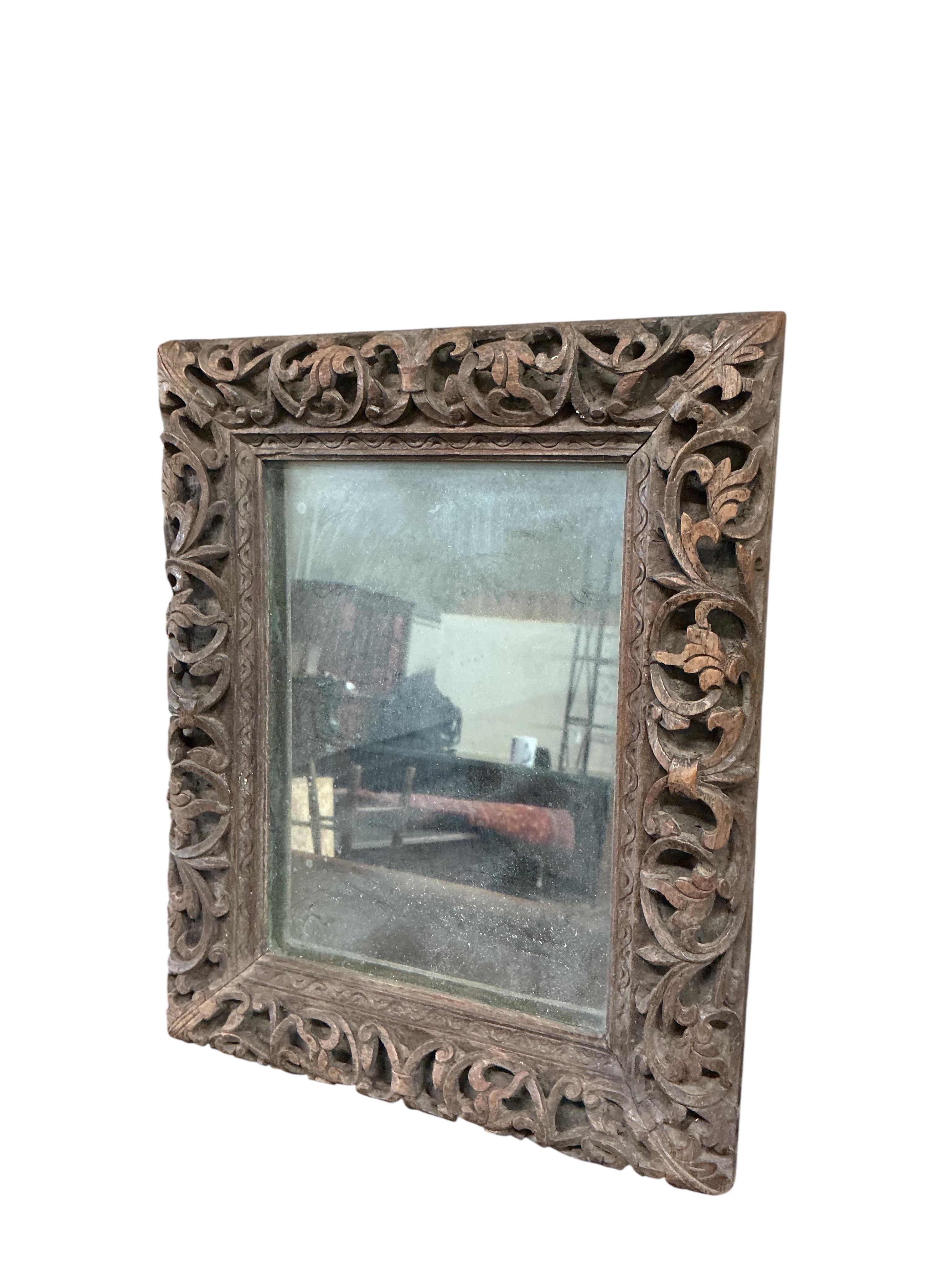A pair of small Victorian rectangular carved oak wall mirrors, width 22cm, height 28cm
